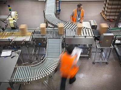 Factory workers in bottling plant